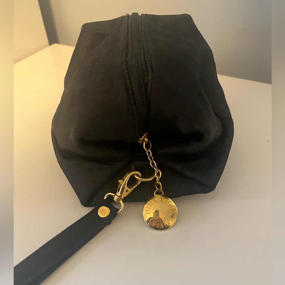 Nina Ricci zippered wristlet